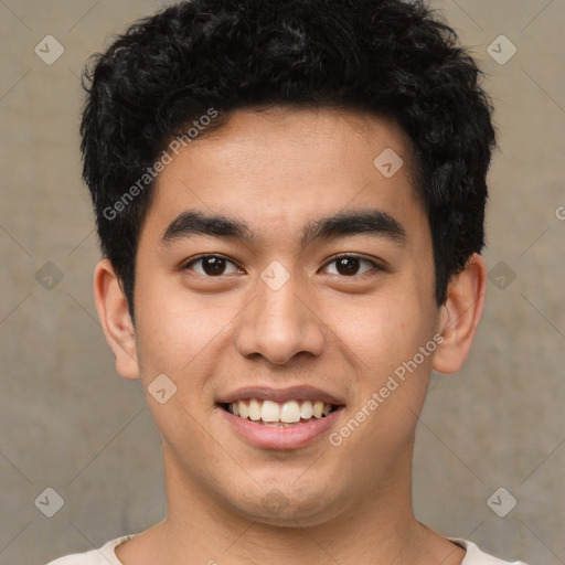 Joyful latino young-adult male with short  brown hair and brown eyes