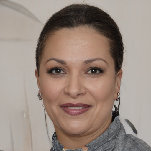 Joyful white adult female with short  brown hair and brown eyes