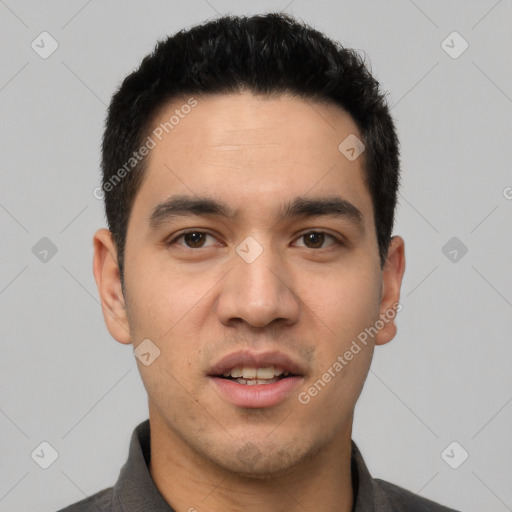 Joyful white young-adult male with short  black hair and brown eyes