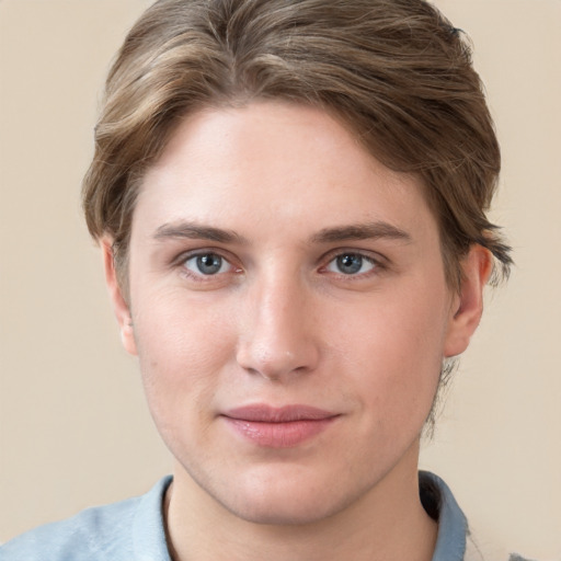 Joyful white young-adult female with short  brown hair and grey eyes