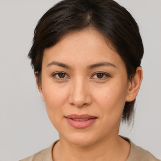 Joyful white young-adult female with medium  brown hair and brown eyes