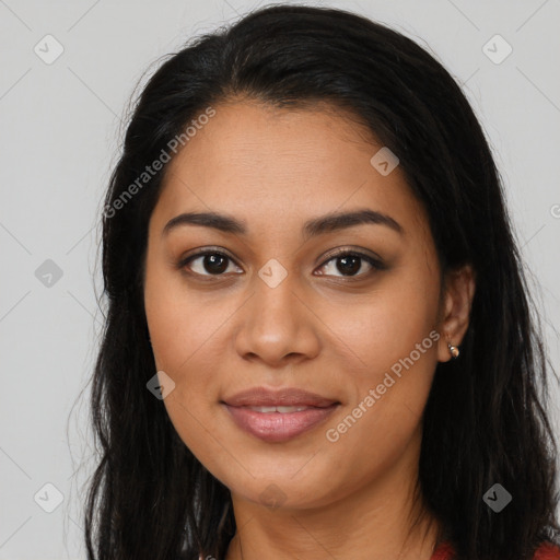 Joyful latino young-adult female with long  brown hair and brown eyes