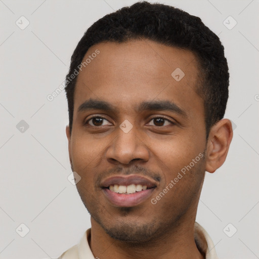 Joyful black young-adult male with short  black hair and brown eyes