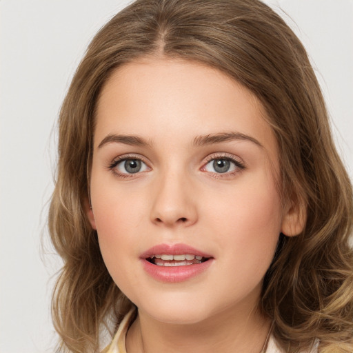 Joyful white young-adult female with long  brown hair and green eyes