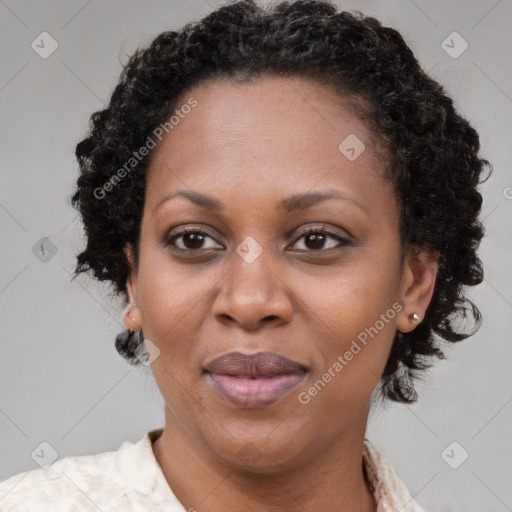 Joyful black adult female with medium  brown hair and brown eyes