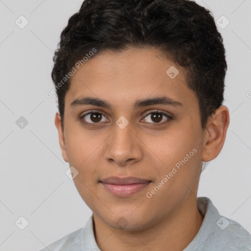 Joyful latino young-adult male with short  brown hair and brown eyes