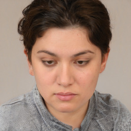 Neutral white young-adult female with short  brown hair and brown eyes