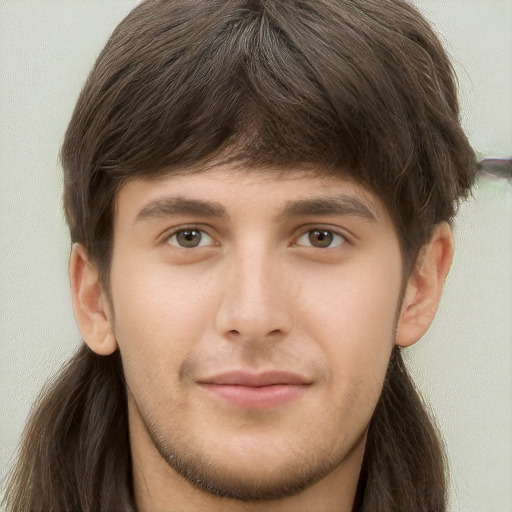 Neutral white young-adult male with long  brown hair and brown eyes