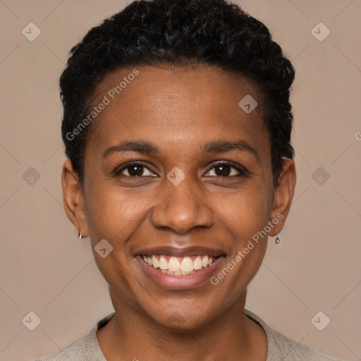 Joyful black young-adult female with short  black hair and brown eyes