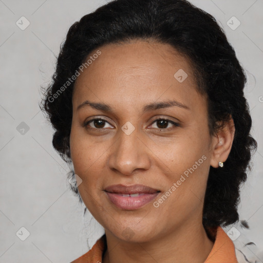 Joyful latino adult female with medium  brown hair and brown eyes