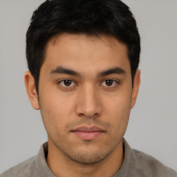 Neutral asian young-adult male with short  brown hair and brown eyes