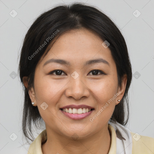 Joyful asian young-adult female with medium  brown hair and brown eyes