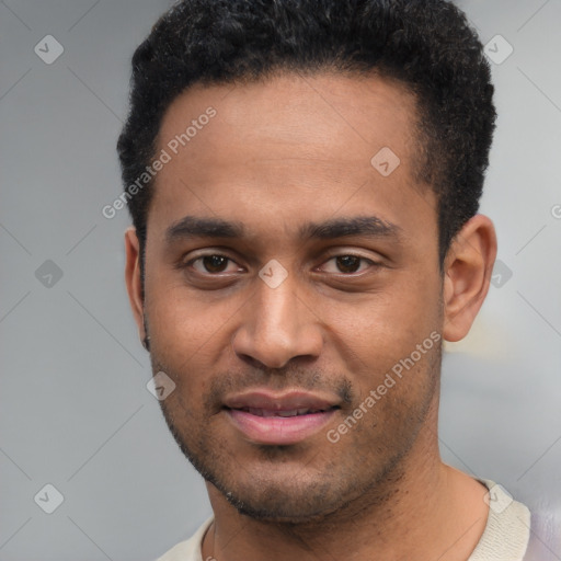 Joyful black young-adult male with short  black hair and brown eyes