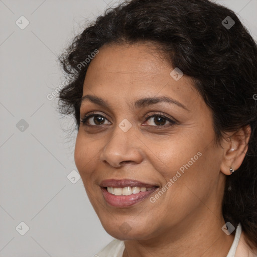 Joyful white adult female with long  brown hair and brown eyes