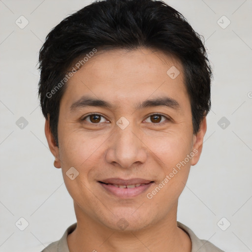 Joyful white young-adult male with short  black hair and brown eyes