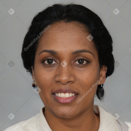 Joyful black adult female with short  black hair and brown eyes