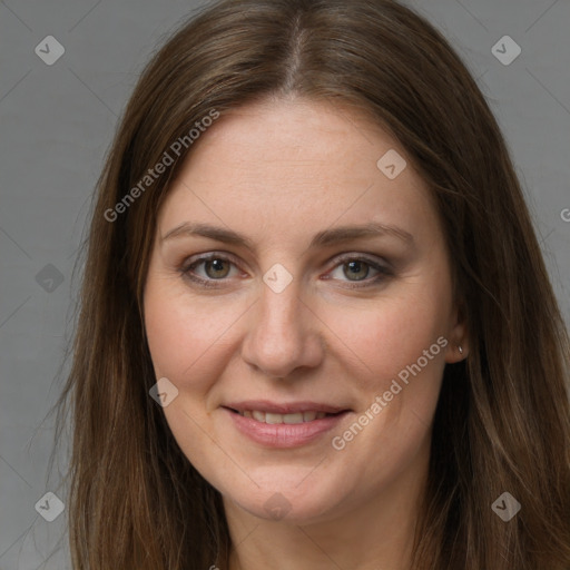 Joyful white young-adult female with long  brown hair and grey eyes