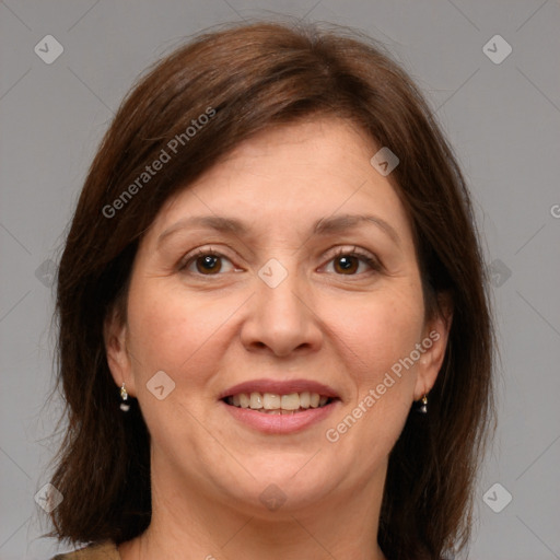 Joyful white adult female with medium  brown hair and grey eyes