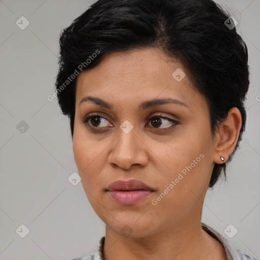 Joyful latino young-adult female with medium  brown hair and brown eyes