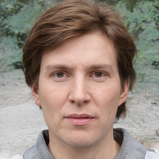 Joyful white adult male with medium  brown hair and grey eyes