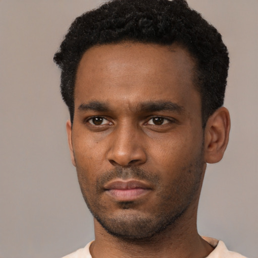 Neutral black young-adult male with short  black hair and brown eyes
