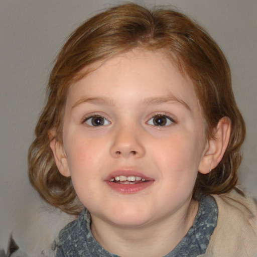 Joyful white child female with medium  brown hair and blue eyes