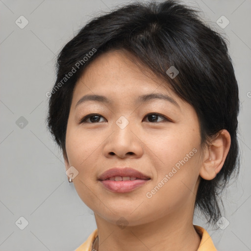 Joyful asian young-adult female with medium  brown hair and brown eyes