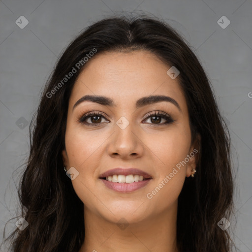 Joyful latino young-adult female with long  brown hair and brown eyes