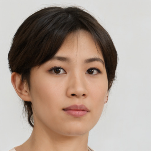 Neutral asian young-adult female with medium  brown hair and brown eyes