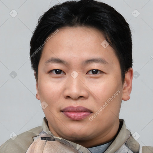 Joyful asian young-adult female with short  black hair and brown eyes