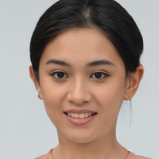 Joyful asian young-adult female with medium  brown hair and brown eyes