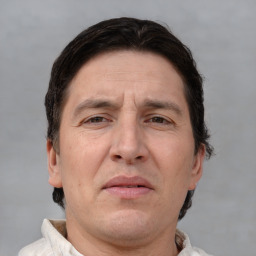 Neutral white adult male with short  brown hair and brown eyes