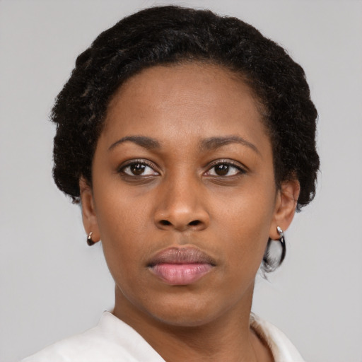Neutral black young-adult female with short  brown hair and brown eyes
