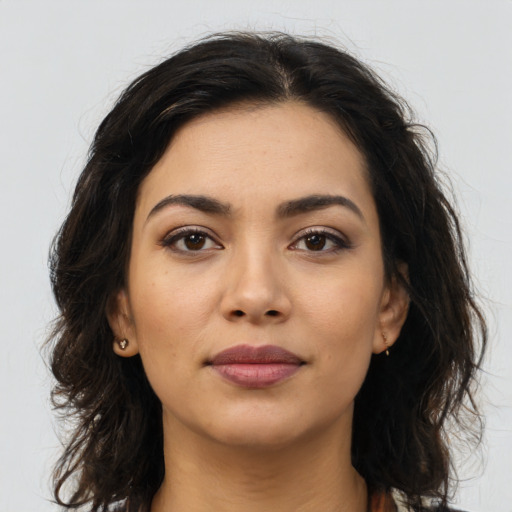 Neutral latino young-adult female with long  brown hair and brown eyes