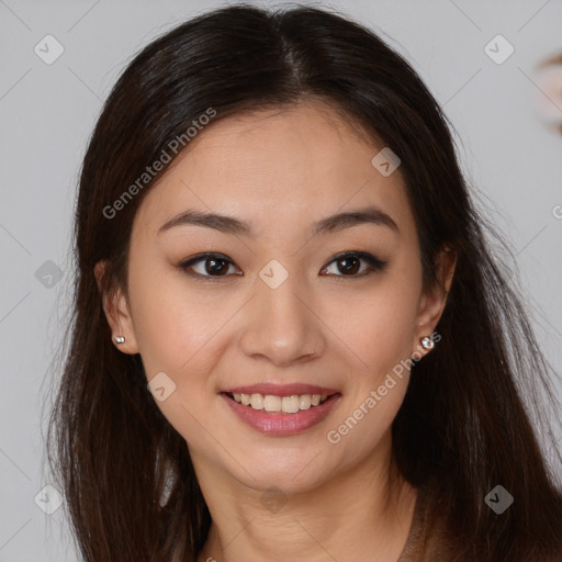 Joyful asian young-adult female with long  brown hair and brown eyes