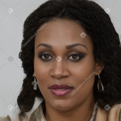 Joyful black young-adult female with long  brown hair and brown eyes