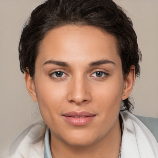 Joyful white young-adult female with medium  brown hair and brown eyes