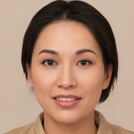 Joyful white young-adult female with medium  brown hair and brown eyes