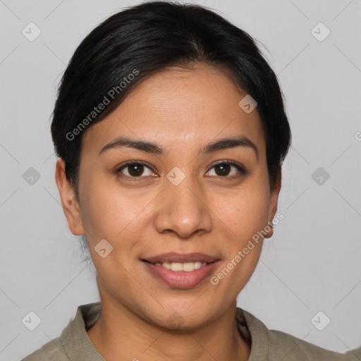 Joyful latino young-adult female with short  brown hair and brown eyes