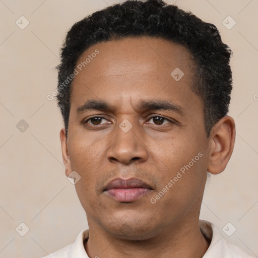 Neutral latino young-adult male with short  black hair and brown eyes