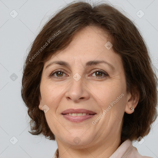 Joyful white adult female with medium  brown hair and brown eyes