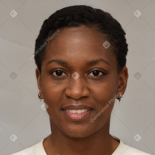 Joyful black young-adult female with short  black hair and brown eyes