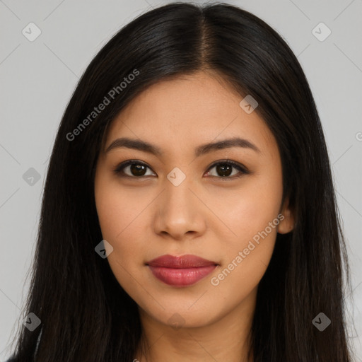 Joyful latino young-adult female with long  brown hair and brown eyes