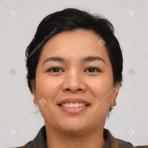 Joyful asian young-adult female with short  black hair and brown eyes