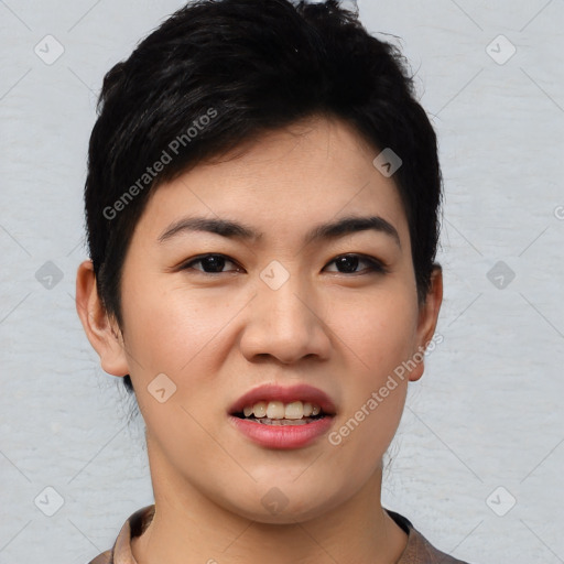 Joyful asian young-adult female with short  black hair and brown eyes