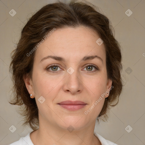 Joyful white adult female with medium  brown hair and green eyes