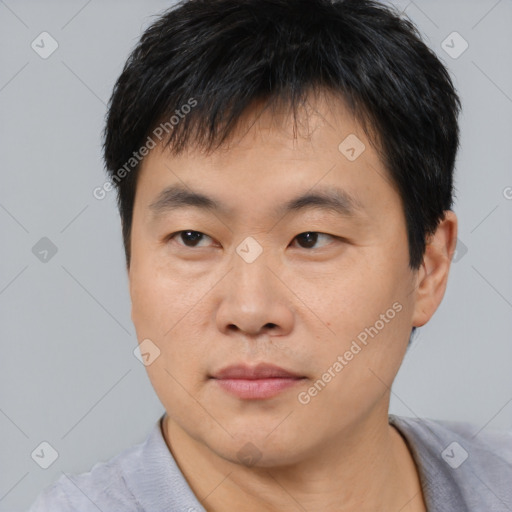 Neutral asian young-adult male with short  black hair and brown eyes