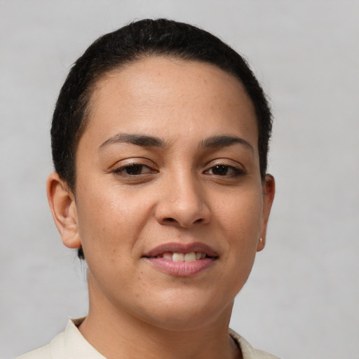 Joyful white young-adult female with short  brown hair and brown eyes