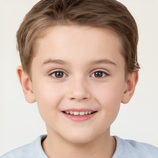 Joyful white child male with short  brown hair and brown eyes