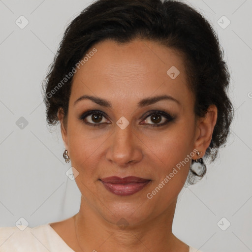 Joyful latino adult female with short  brown hair and brown eyes